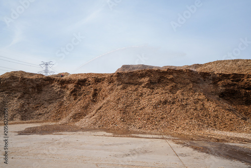 Wood chips and raw materials are piled together in a factory in North China