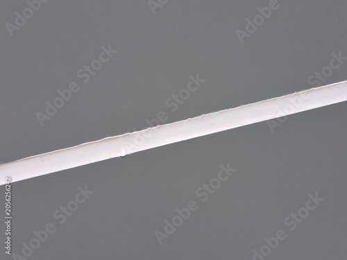 Minimalist diagonal white line on a grey background