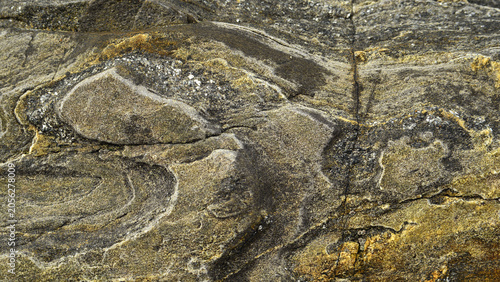 фотографія A strange rock formation in which different layers of various minerals can be seen