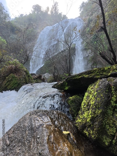 A beautiful waterfall in the tropical rainforest, Khlong Lan Waterfal, Thailand.