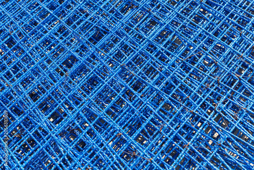 Fiberglass (composite) reinforcement in blue color is connected in a grid