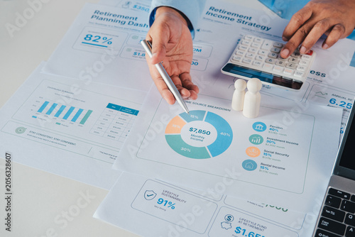 Konstfotografi Financial advisor reviewing retirement readiness assessment dashboard with retir