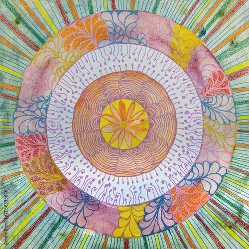 Mandala with floral pattern and stripes on the background. The dabbing technique gives a soft focus effect due to the altered surface roughness of the paper.