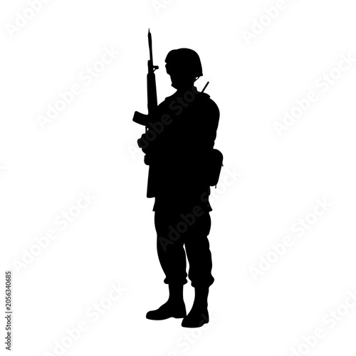 Silhouette of a Soldier Standing Guard with Rifle.