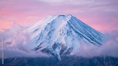 Bild auf Leinwand Close-up of Snow-Covered Mount Fuji Summit at Pink Twilight