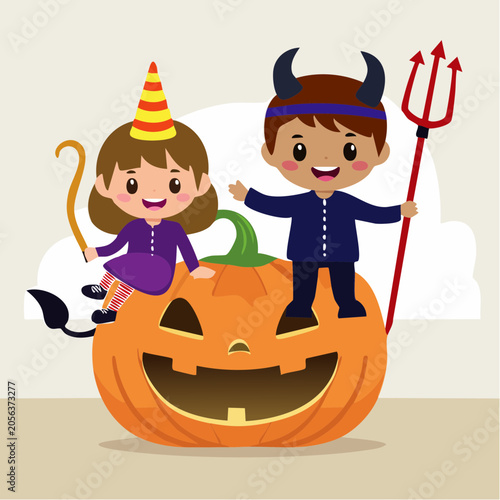 Children in Halloween Costumes Sitting on a Jack-o'-Lantern