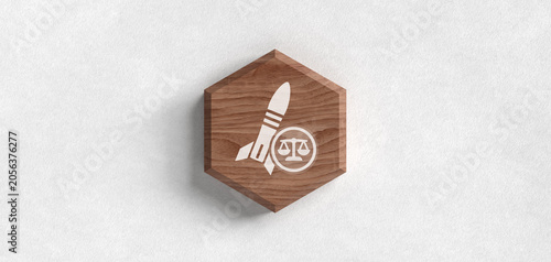Foto A wooden hexagon icon with a rocket and a scale of justice symbol on a white background, representing legal expertise for aerospace technology and defense regulations compliance