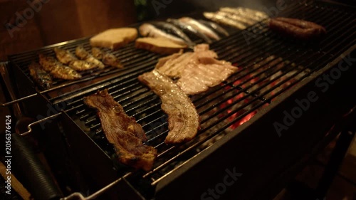 Traditional Portuguese Sardines Pork Bifanas and Chorizo Sausage on Grill at Santos Populares Lisbon Shot with Cinema Camera