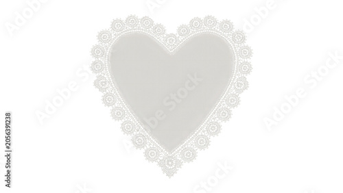 Fotografía White heart shaped paper doily with intricate lace pattern isolated on a white b