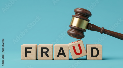 Wooden Blocks Spelling Fraud Being Struck by a Judges Gavel Representing Legal Action Against Deceptive Financial Practices