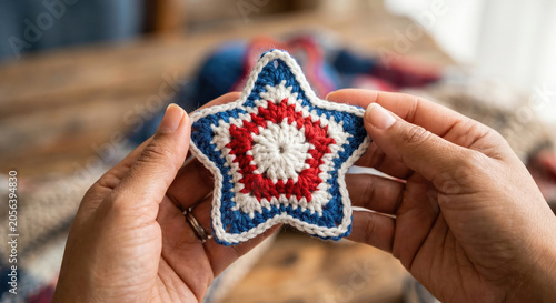 american man holdinHands holding patriotic crochet star photo red white blue Fourth of July handmade craft.

