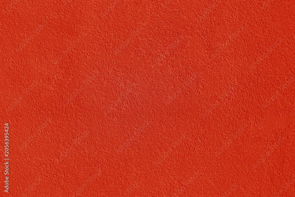 Fototapeta premium Textured background. Decorative in plaster wall, external of facade. Texture of red scarlet pink stucco plaster wall of clay house structure concrete background. Brown clay mud cement texture pattern