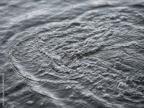Close-up view of rough stone wall texture with gray tones