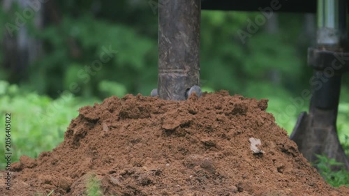 engineering geological surveys, environmental soil analysis, a drill drills into the soil