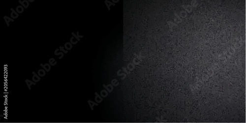 Foto A stark split image, with one half pure black and the other a textured dark grey surface, creating a dramatic contrast of light and shadow
