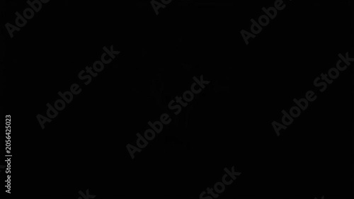 Glowing light bulb icon on black background