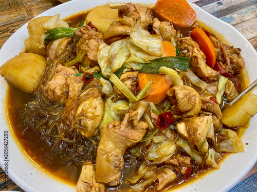hearty korean braised chicken stew with potatoes and glass noodles top down view