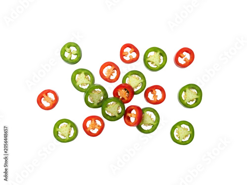 Scattered Sliced Jalapeño Peppers in Red and Green Colors