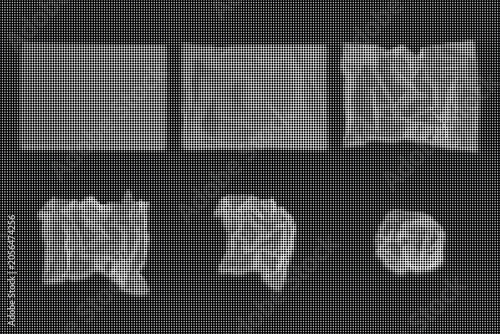 Fotografi Crinkled plastic sheets arranged in two rows on a dark surface.