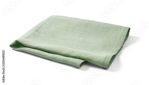 Photos Soft, light green linen towel neatly folded against a white background
