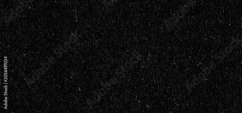 Black grain noise texture background. Distressed grainy surface with vintage dust and scratches. Abstract dark overlay for graphic design project and creative visual art composition