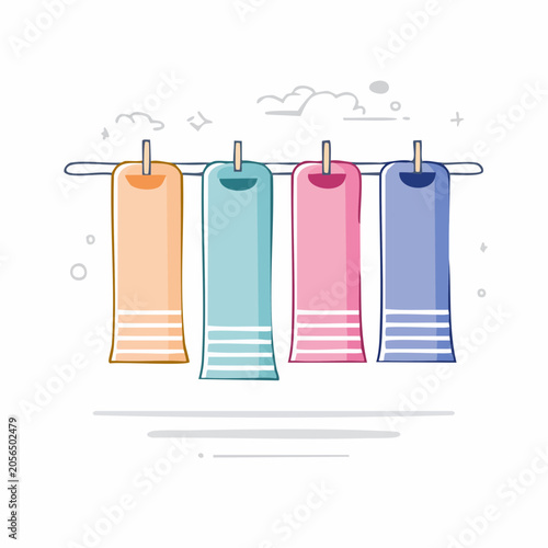 Four colorful towels hanging on a clothesline
