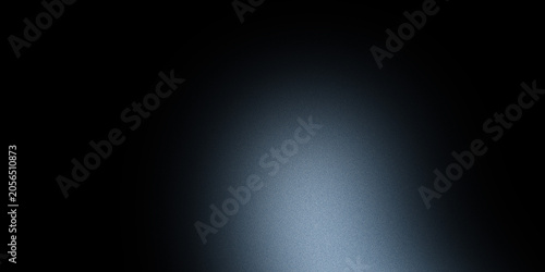 Soft blue spotlight on dark textured background