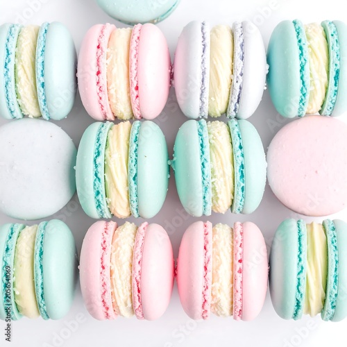 Pastel French Macarons Arranged in Neat Pattern on Light Background