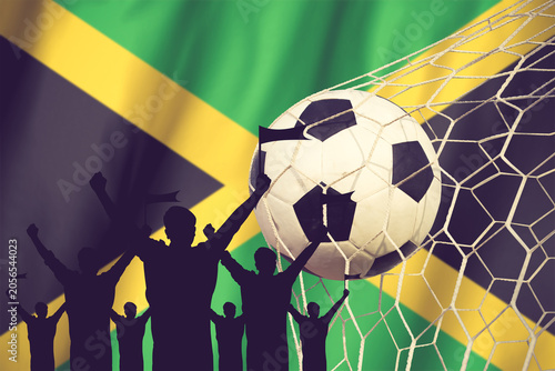 Silhouettes Of Soccer Fans With Flag Of Jamaica .Cheer Concept Vintage Color