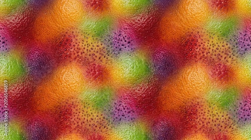 A vibrant, textured surface displays a colorful pattern of overlapping citrus fruits.