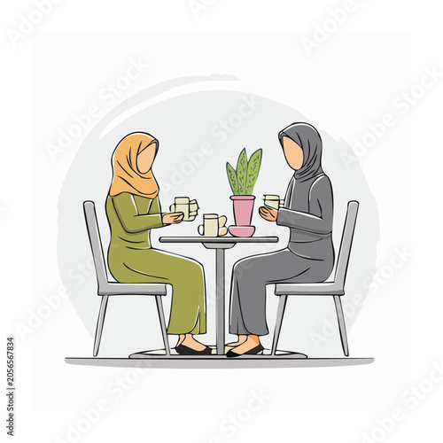 Two people in business meeting with plant and laptop