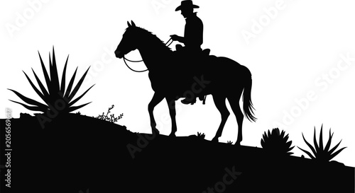 Foto Black silhouette of a lone cowboy on horseback passing a desert agave plant with