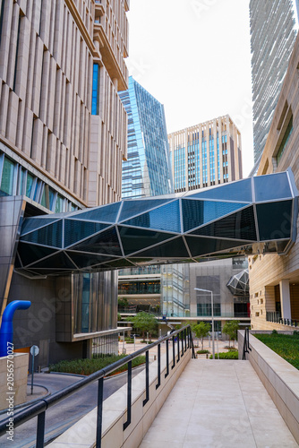 Pedestrian walkway and geometric glass skybridge connecting skyscrapers at King Abdullah Financial District (KAFD) in Riyadh, Saudi Arabia