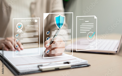 Schilderij op canvas Businesswoman reviewing insurance contracts and financial documents, providing client advisory services for health and life insurance planning