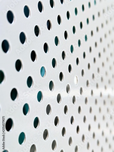 Abstract White Perforated Metal Sheet Background with Seamless Circular Pattern for Modern Minimalist Design Texture
