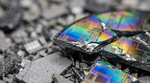 Broken silicon wafer shards with iridescent microchip patterns