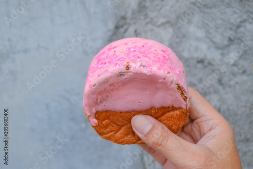 Cromboloni, Croissant Bomboloni. Round New York Roll with Strawberry Sauce on hand.