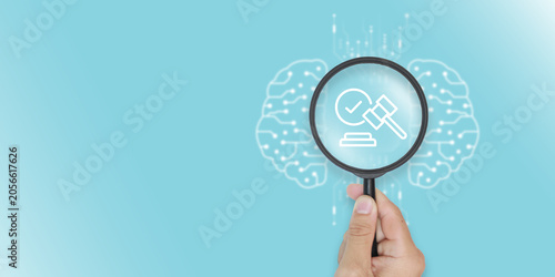 Принти на полотні Magnifying glass focusing on law icon and gavel for legal AI compliance