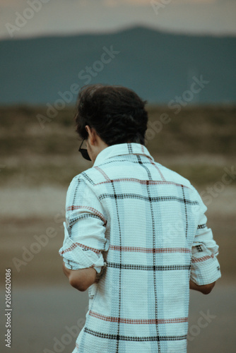 young man looking at the sea