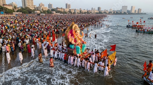 Ganesha idol immersion procession at Mumbai beach during Ganesh Chaturthi festival with devotees carrying elaborately decorated deity into ocean
