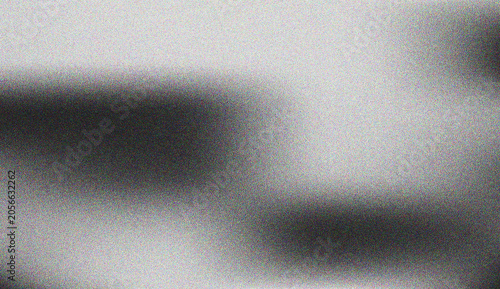 Abstract grainy grey texture with a subtle dark gradient creating a smooth soft visual effect