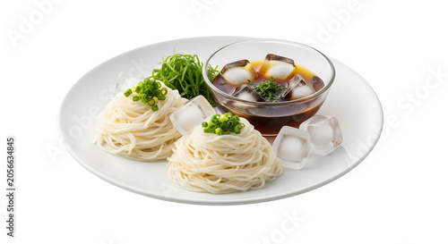 Refreshing cold somen noodles with dipping sauce and ice cubes on a white plate