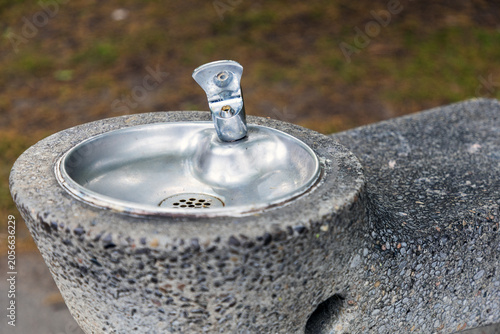 Konstfotografi Close-up view of public drinking water fountain in urban park