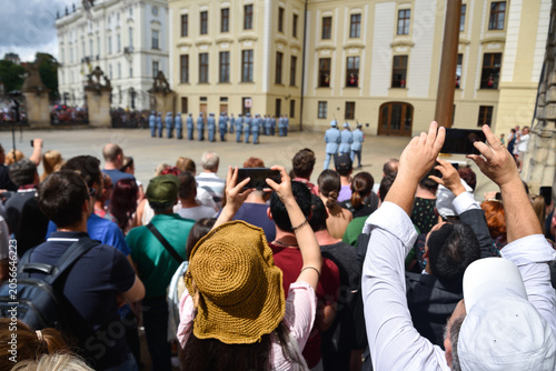 Tourists Taking Pictures with Phones at Prague Castle in Czech Republic