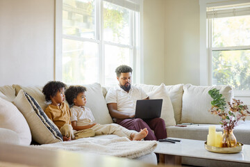 Father and Children Watch Video at Home Together