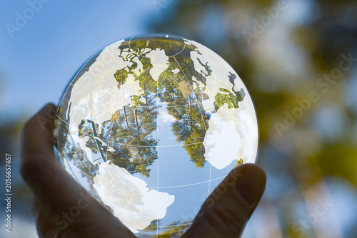 Foto World Globe map on a glassball with nature inside and being out in the nature and in the forest in Denmark/Scandinavia