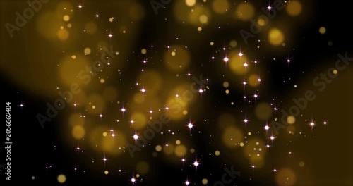 Golden lights, glittering shiny gold particles and shimmering bokeh light spheres. Suitable for backgrounds, overlays, or modern art concepts in graphic design. Abstract bokeh background