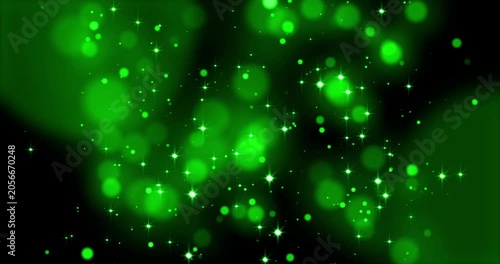 Green lights, glittering shiny green particles and shimmering bokeh light spheres. Suitable for backgrounds, overlays, or modern art concepts in graphic design. Abstract bokeh background