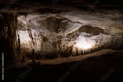 Bild auf Leinwand Underground cave formations with water and stalactites travel destination