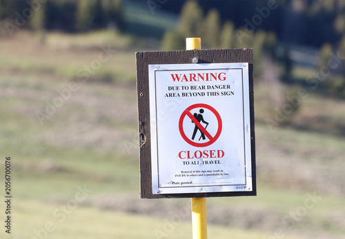 Signs in Yellowstone National Park warn visitors about bear activity in the area